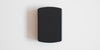 A matte black scale on a white background. The lid is on, covering everything up.