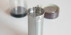 Close up of the strainer basket that fits into the thermos. There is a small wire handle at the top to remove it.