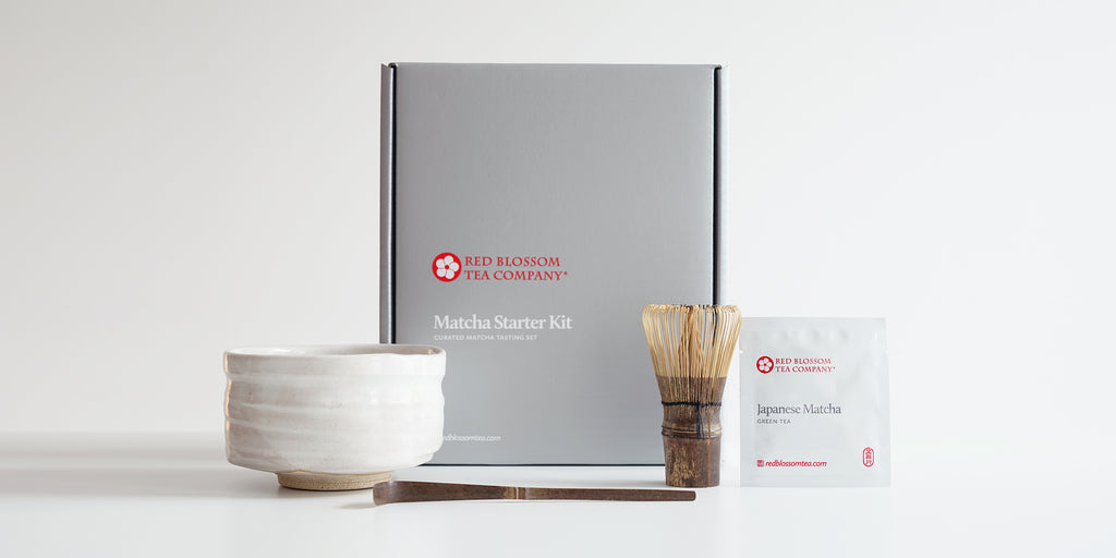 A silver box with a label reading “Matcha Starter Kit”. In front of the box are all the contents of the box.