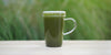 A clear glass mug filled with brewed Lishan Matcha