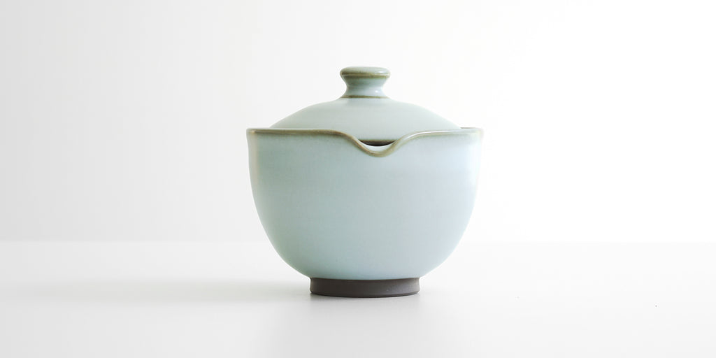 Front view of the shiboridashi showing the hand-shaped spout.