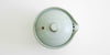 Top down view of the closed shiboridashi, showing the hole in the lid to allow air through and smoother pouring.