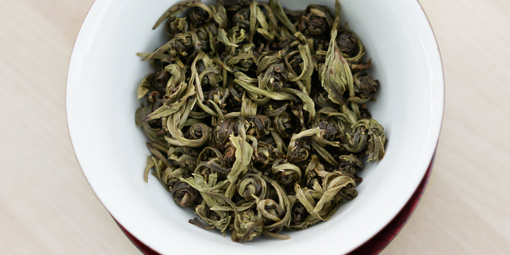 A top-down photo of brewed white tea leaves in a gaiwan.
