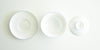The tops of all the pieces for the gaiwan. From left to right, the plate, the bowl, and the lid