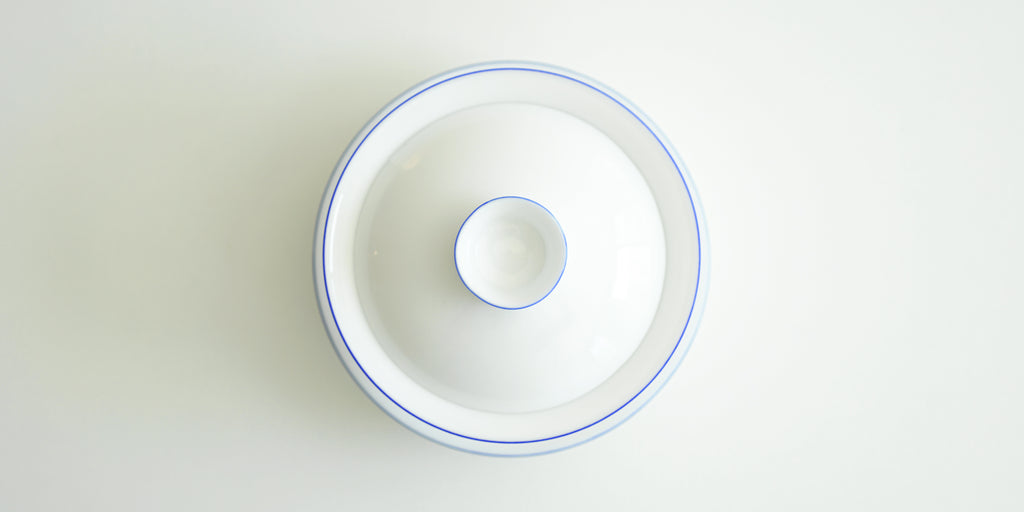 Top down view of the gaiwan, showing the concentric blue circles around the rims of each piece.