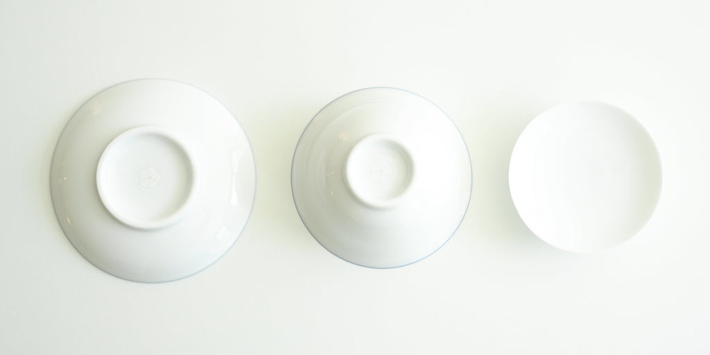 The bottoms of all the pieces for the gaiwan. From left to right, the plate, the bowl, and the lid