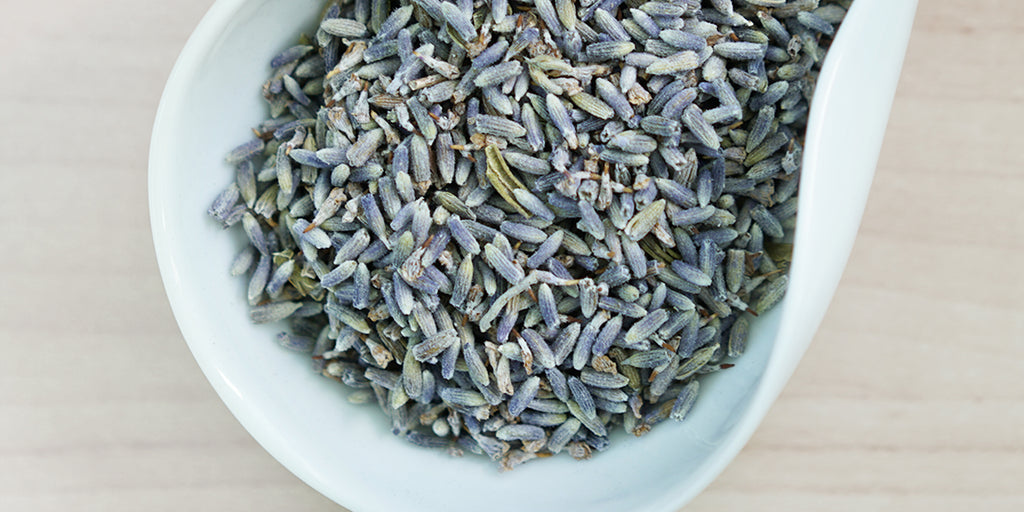 A white dish containing dry lavender.