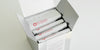 A silver box with 4 white bags of tea showing the Red Blossom Tea Company logo inside.