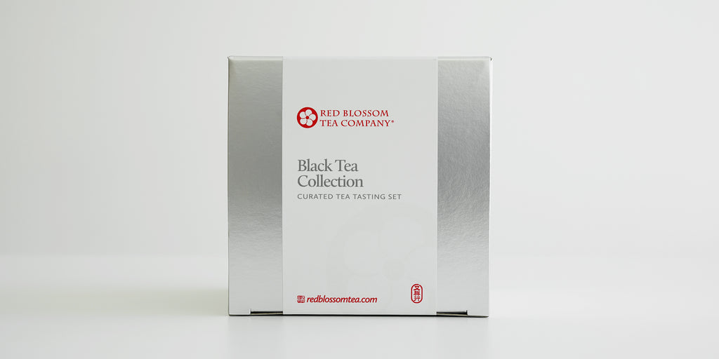 A silver box with a white label reading “Black Tea Collection”