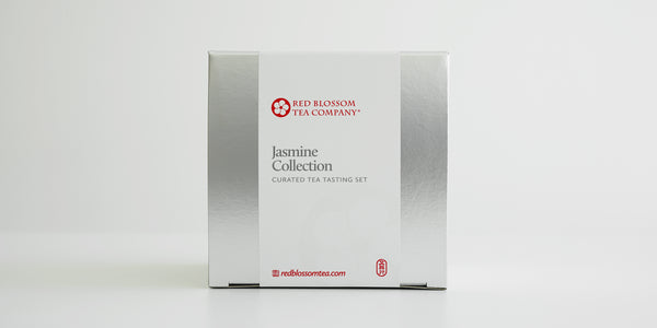 A silver box with a white label reading “Jasmine Collection”